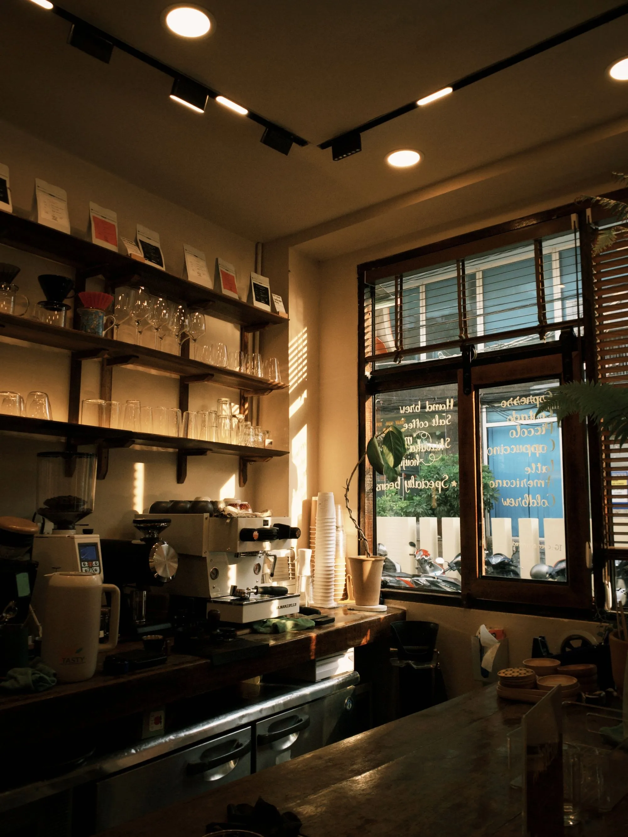 The warm, light-filled interior of our San Francisco café and roastery