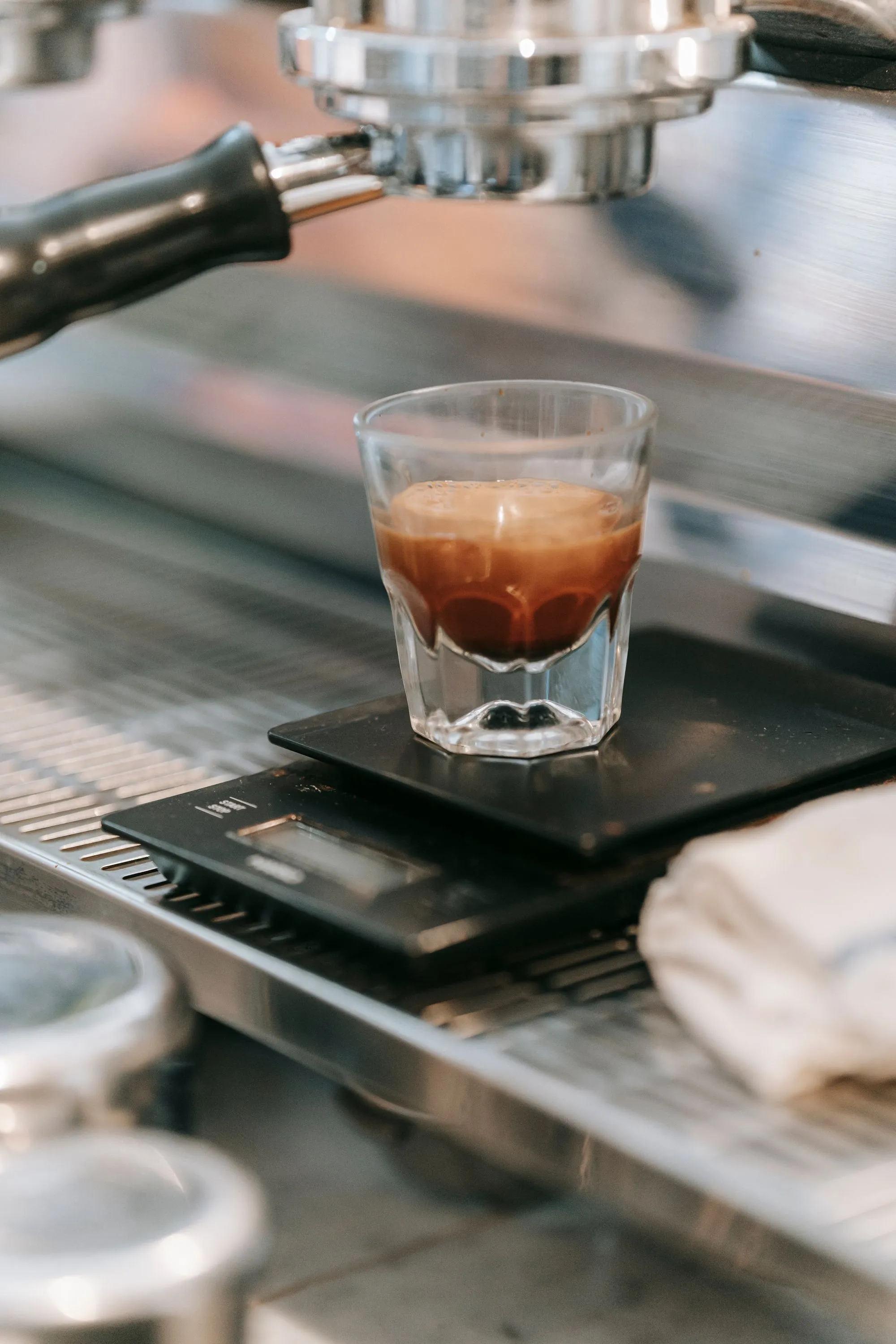 A freshly pulled espresso with rich crema in moody light